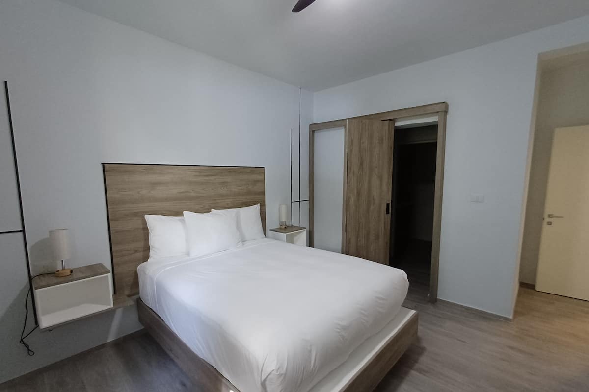 Deluxe Apartment, Multiple Beds | 2 bedrooms, down comforters, minibar, in-room safe