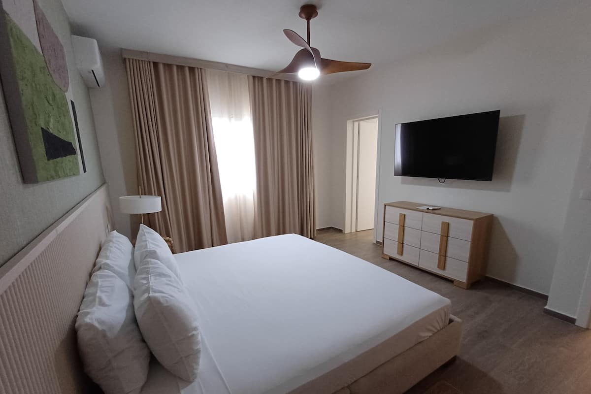 Deluxe Apartment | Down comforters, minibar, in-room safe, iron/ironing board (on request)