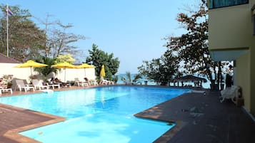 Outdoor pool, open 8:30 AM to 7:00 PM, pool loungers