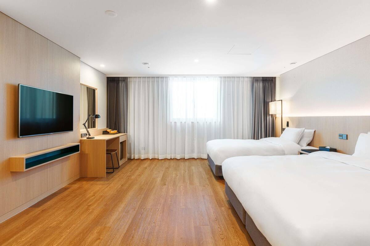 Deluxe Room, Multiple Beds, Non Smoking | Premium bedding, desk, laptop workspace, soundproofing
