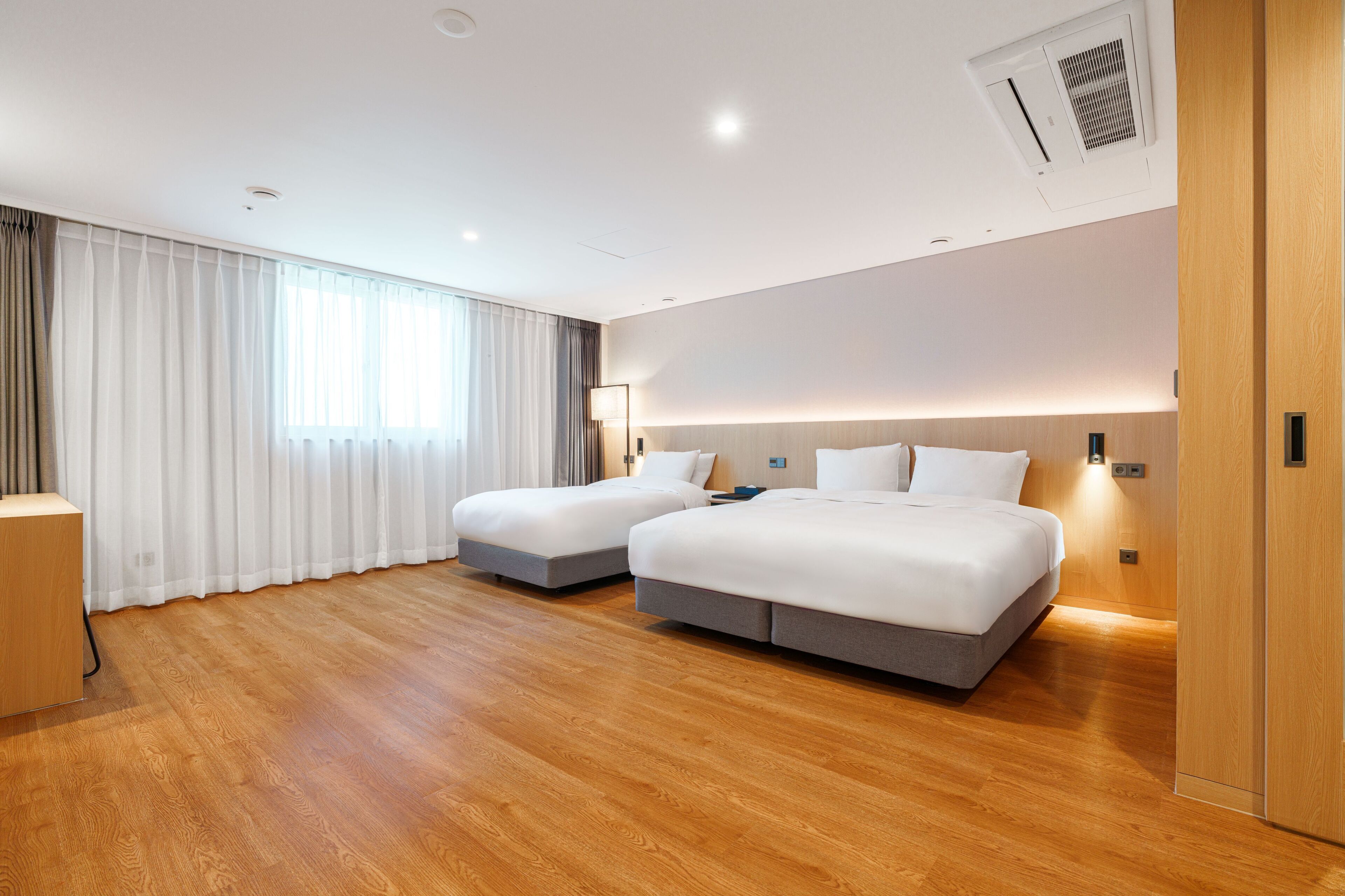 deluxe room, multiple beds, non smoking | premium bedding, desk, laptop workspace, soundproofing