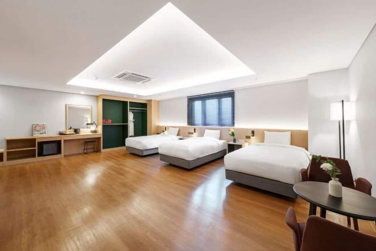Premium bedding, desk, laptop workspace, soundproofing