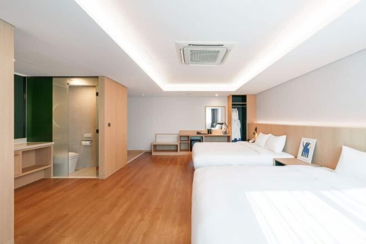 Premium bedding, desk, laptop workspace, soundproofing