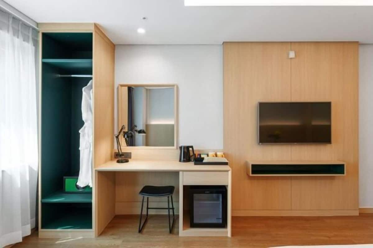 Premium bedding, desk, laptop workspace, soundproofing