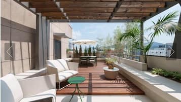 Deluxe Suite, 2 Double Beds, Balcony | Terrace/patio