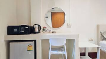 Standard Double Room, No Windows | In-room safe, desk, laptop workspace, blackout drapes