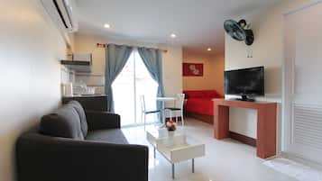 Superior Room Front | Living room | 32-inch flat-screen TV with cable channels