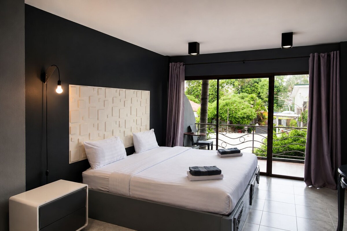 Deluxe Room, 1 King Bed, Balcony, Pool View | In-room safe, blackout drapes, WiFi (free), individually furnished