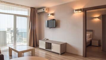 Apartment, 1 Bedroom | Living room | Flat-screen TV, pay movies