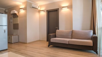 Apartment, 1 Bedroom, Sea View | Living room | Flat-screen TV, pay movies