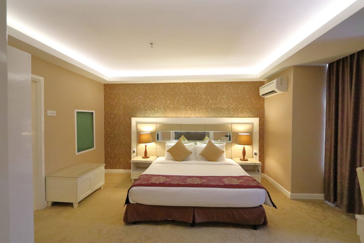 Executive suite, 1 kingsize bed met slaapbank | Kameruitzicht