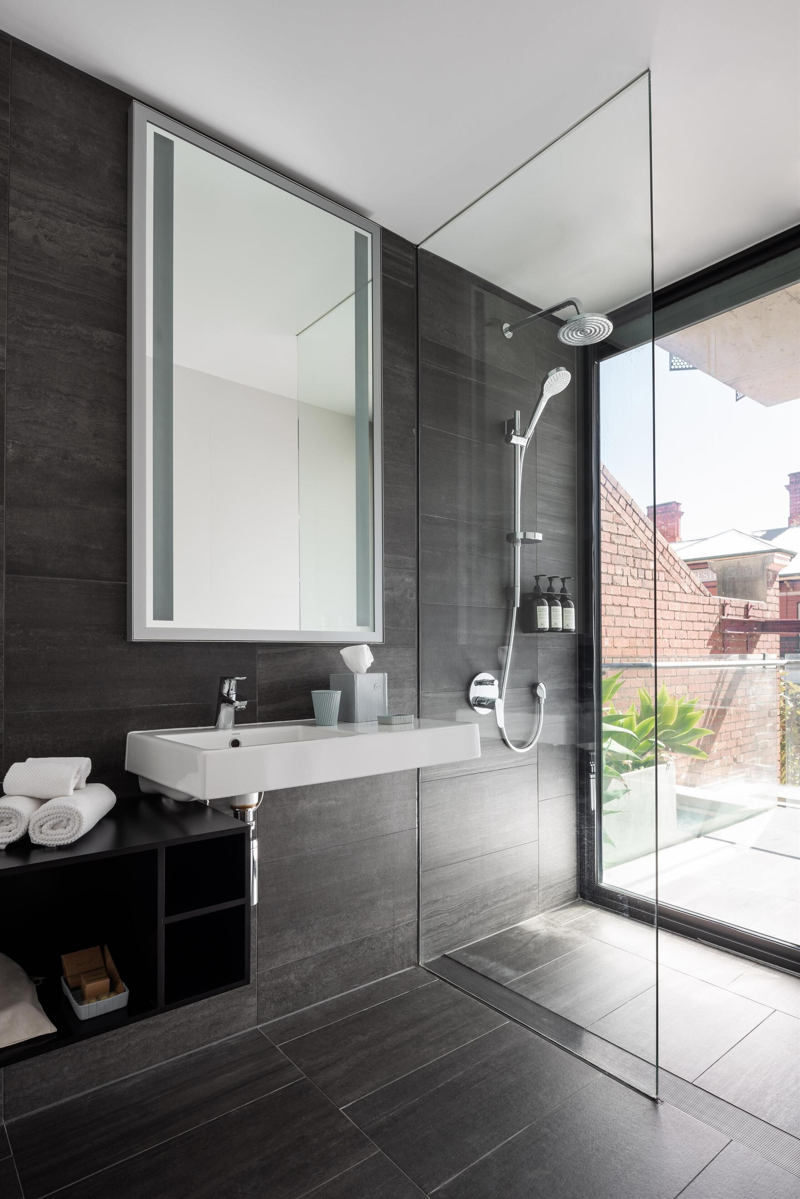 grand room | bathroom | shower, free toiletries, towels