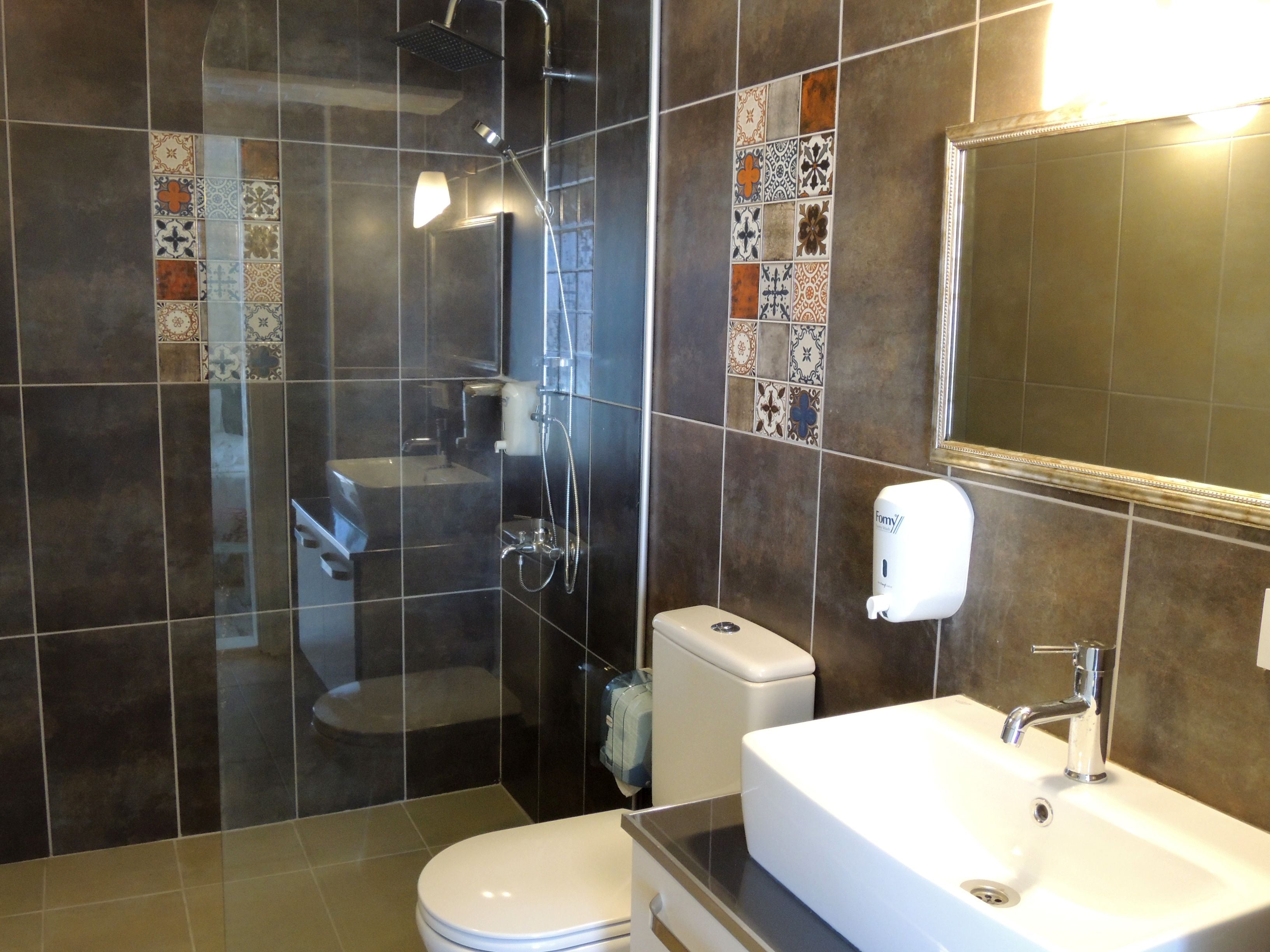 family room, balcony, city view | bathroom | shower, rainfall showerhead, free toiletries, hair dryer