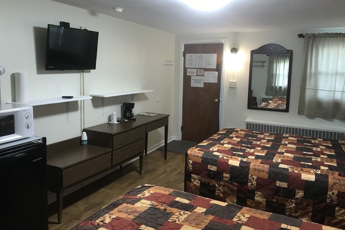 Desk, laptop workspace, blackout curtains, iron/ironing board
