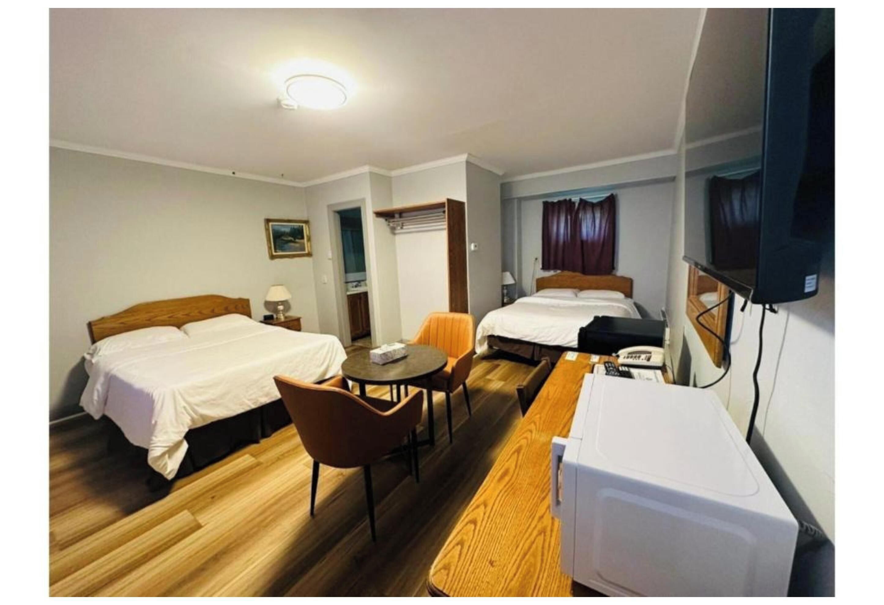 Room, 2 Queen Beds, Non Smoking | Desk, iron/ironing board, WiFi (free), bed sheets