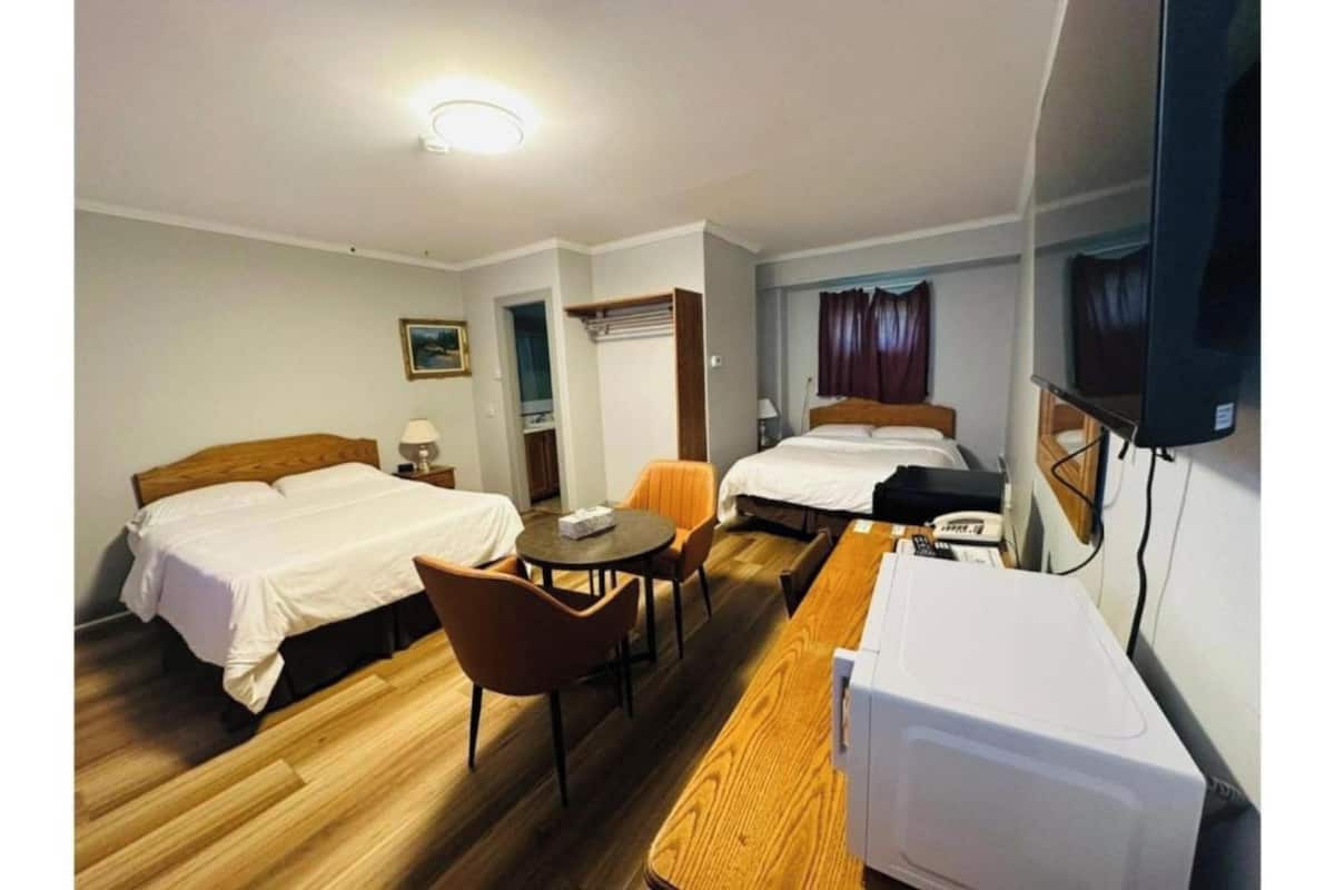 Room, 2 Queen Beds, Non Smoking | Desk, iron/ironing board, WiFi (free), bed sheets