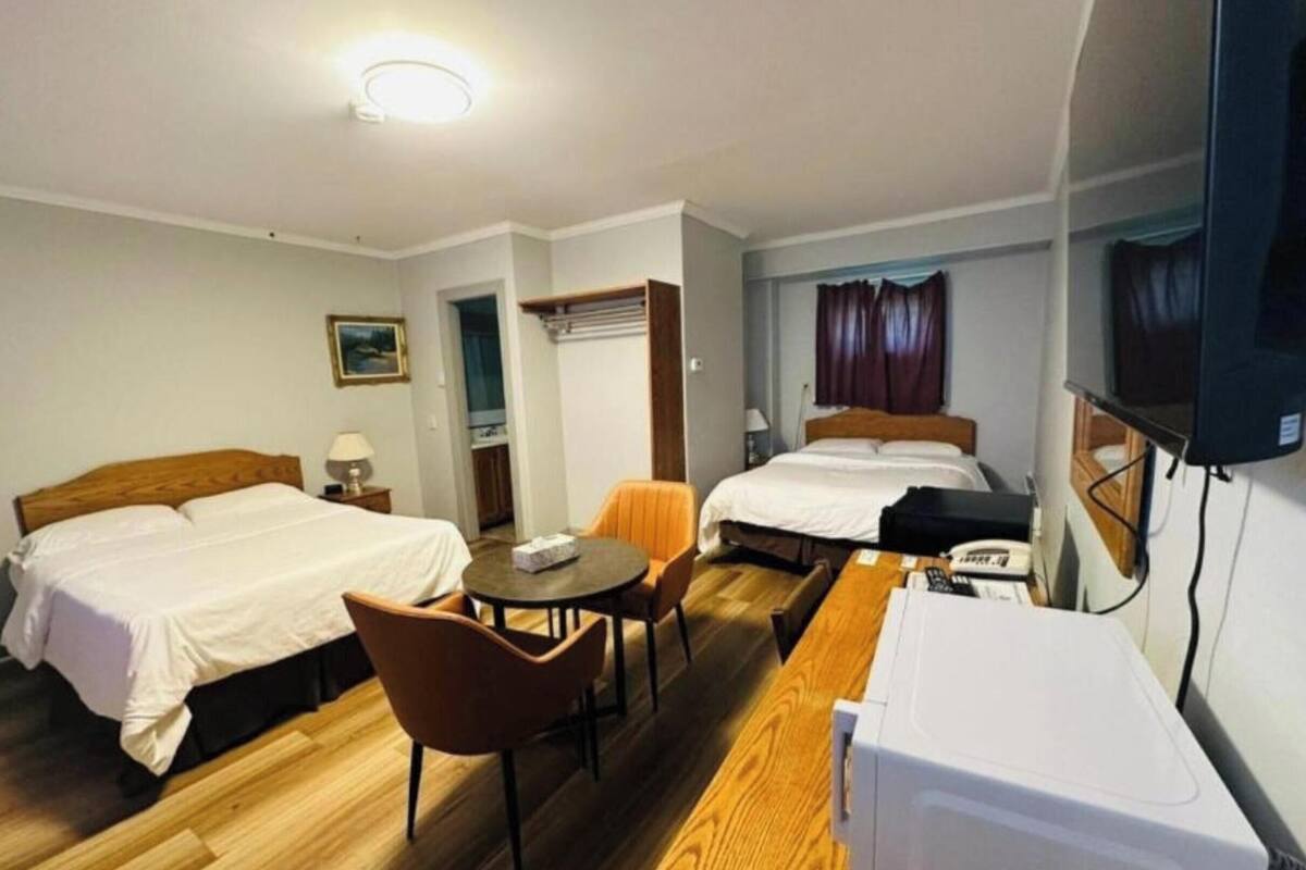 Room, 2 Queen Beds, Non Smoking | Desk, iron/ironing board, free WiFi, bed sheets
