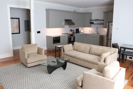 Deluxe Two Bedroom Suite | Living area | Flat-screen TV, Netflix