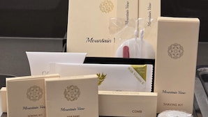 A variety of Mountain View branded products including a sewing kit, hair band, shaving kit, and toothbrush set. - Alpine Motel (Hope)