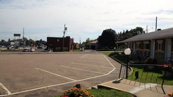 A parking lot with a building in the background.