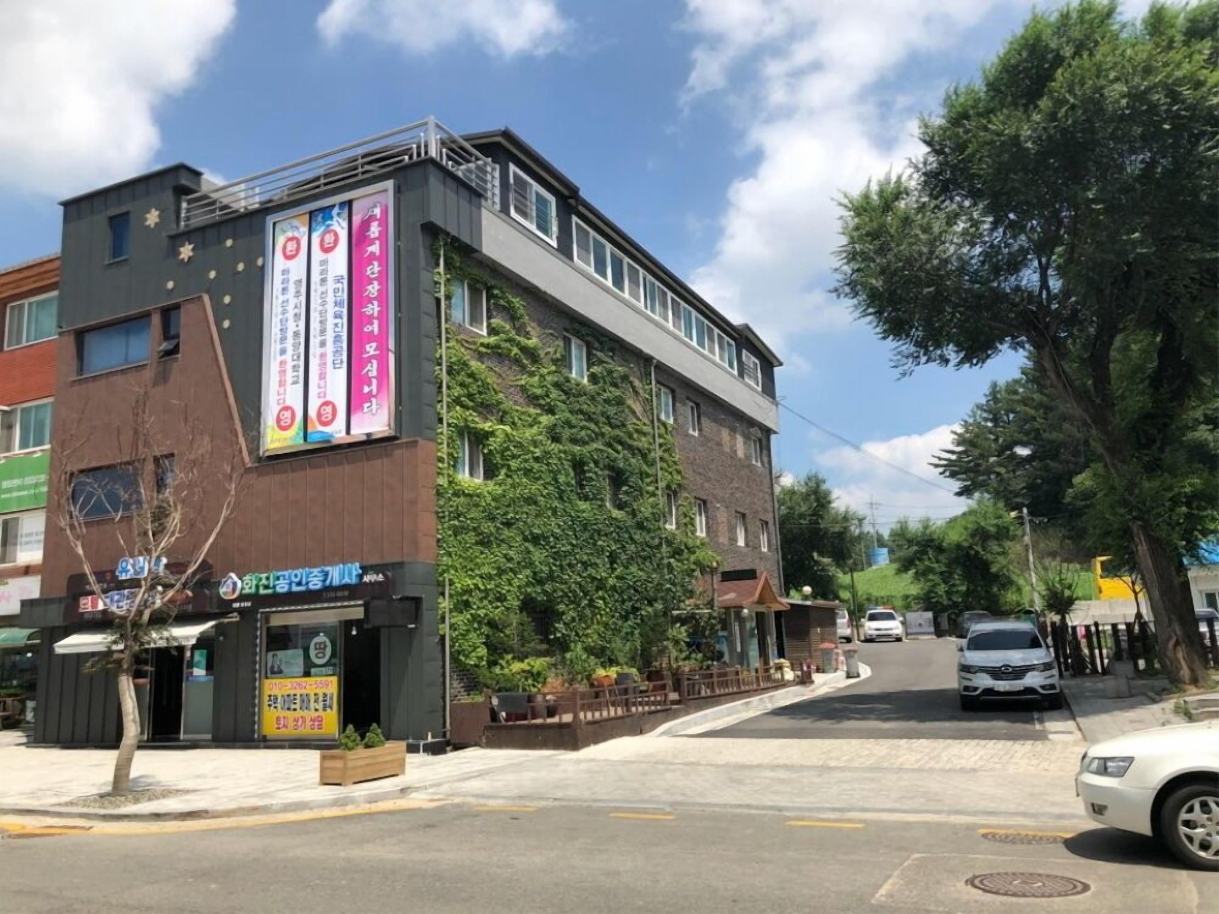 A multi-story building with a storefront on the ground floor.