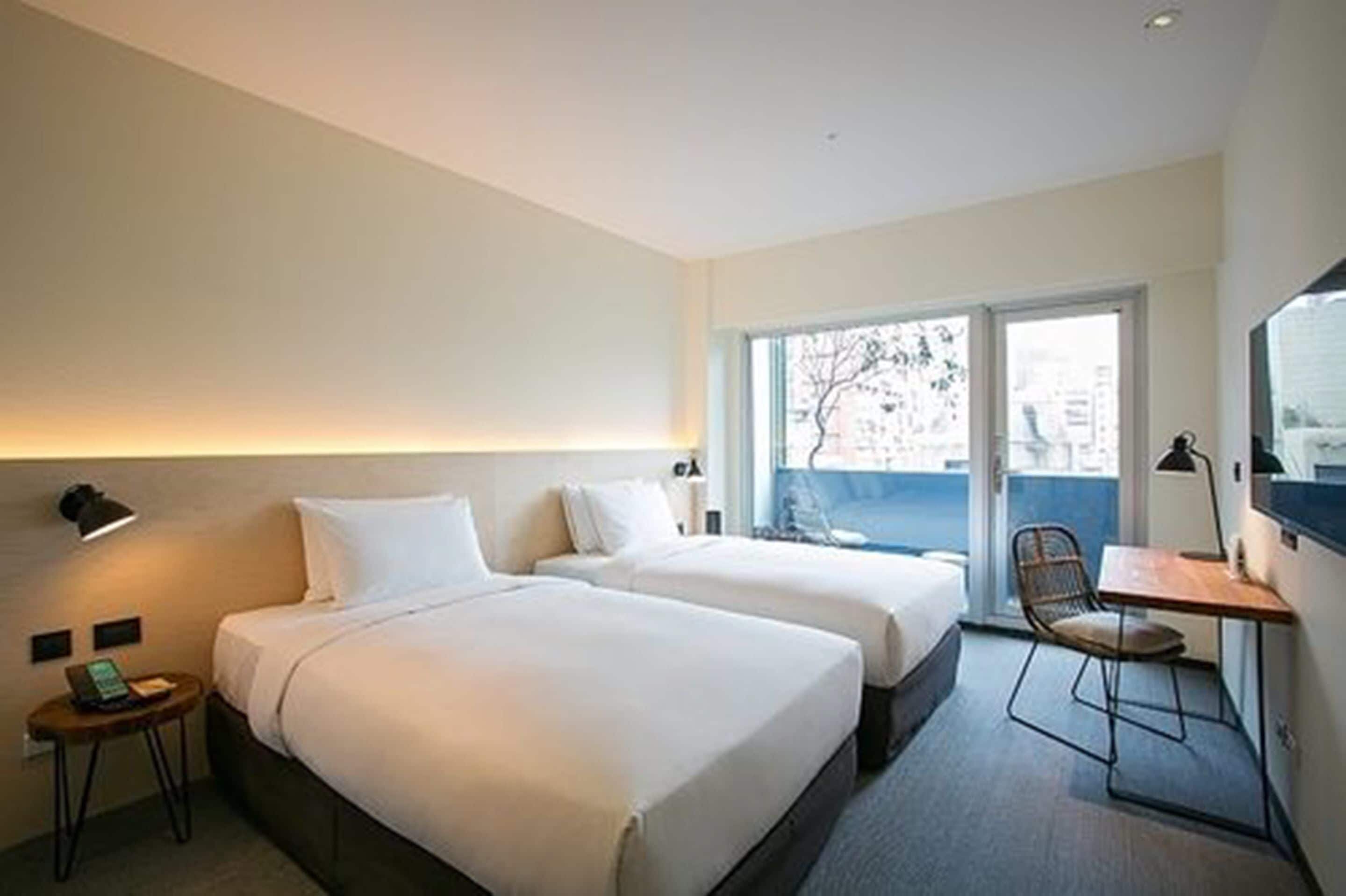 balcony twin | premium bedding, down duvets, in-room safe, desk