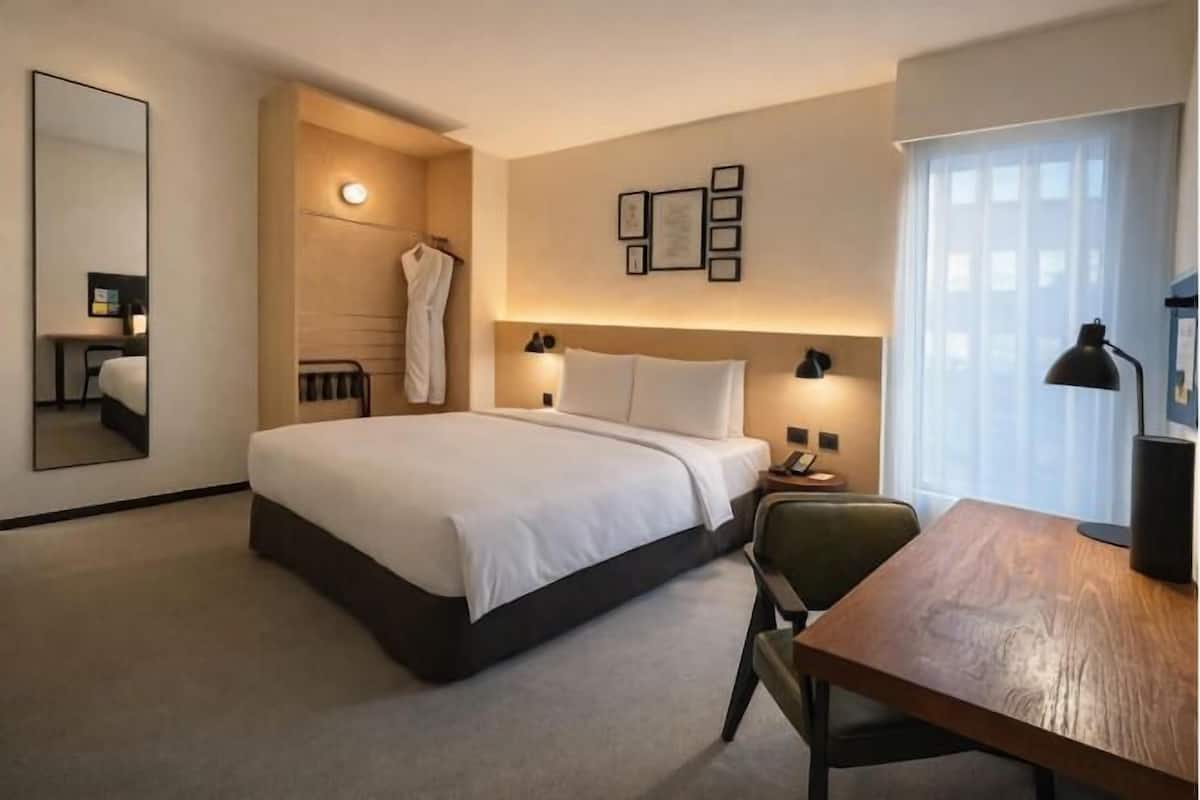 Premium bedding, down duvets, in-room safe, desk