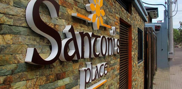 A sign for 'Santome Place' with a stone facade and a modern design. - Santoni's Place (Cebu City)