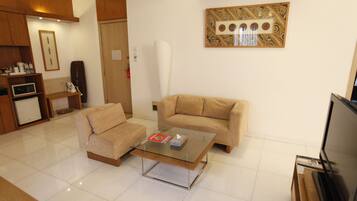 Suite | Living area | Flat-screen TV, fireplace, DVD player, pay movies