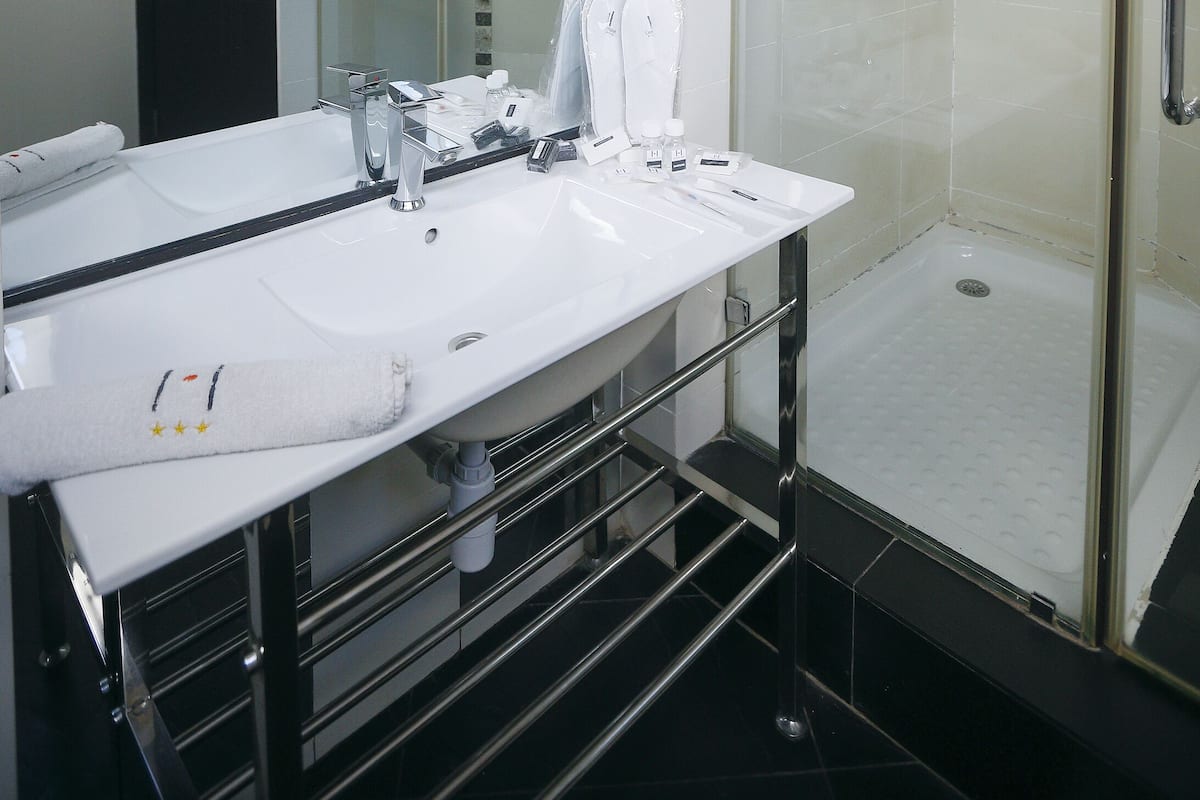Shower, free toiletries, hair dryer, slippers