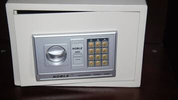 A safe with a keypad and a dial lock.