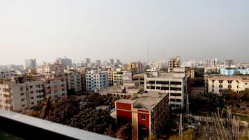 A cityscape with various buildings, including multi-story residential and commercial structures.