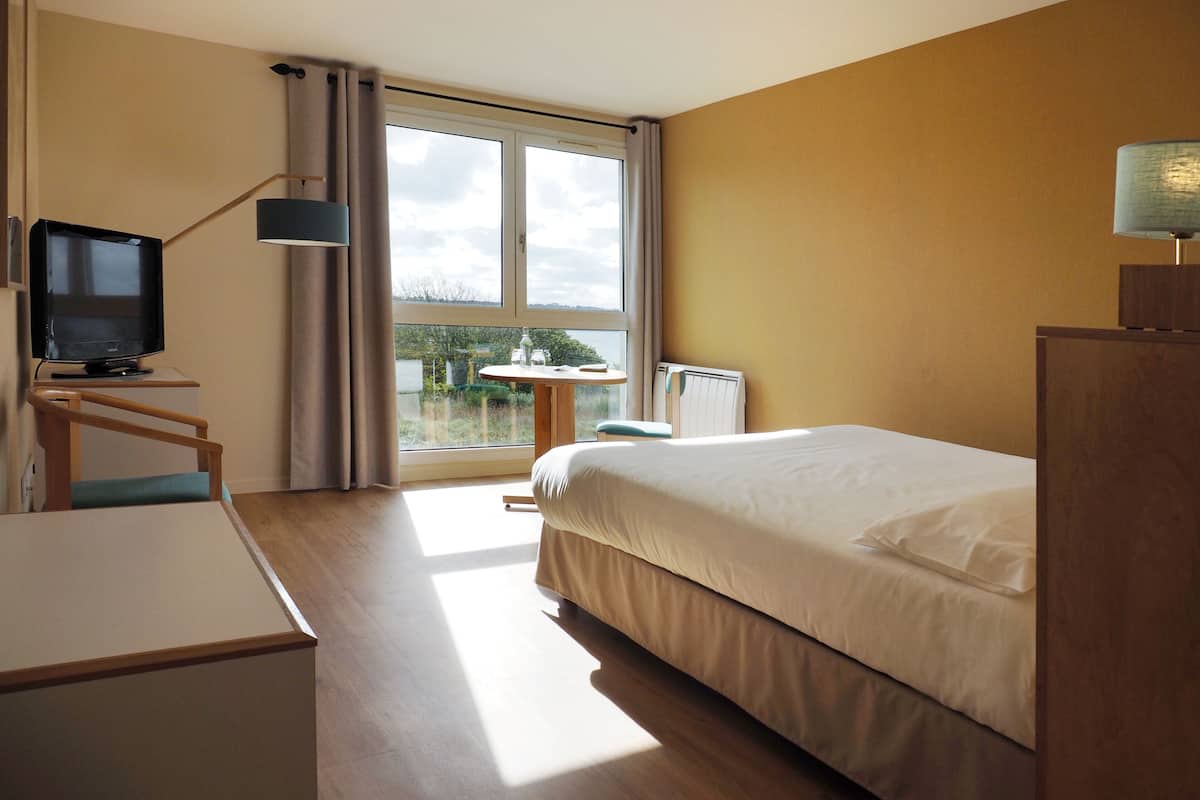 premium bedding, select comfort beds, desk, blackout curtains