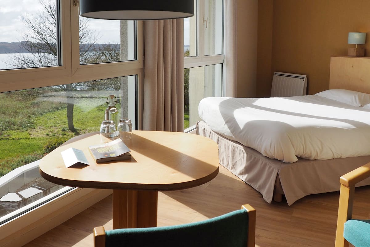 classic double room, partial ocean view | premium bedding, select comfort beds, desk, blackout curtains