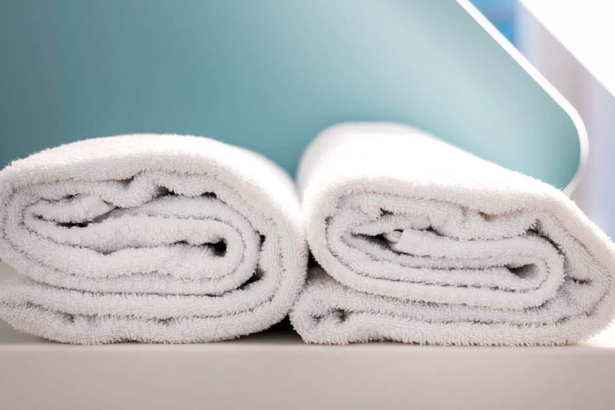 A stack of white towels rolled up.