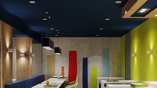 Un interior de restaurante moderno con paneles de madera, sillas coloridas y una variedad de mesas de diferentes formas y tamaños.