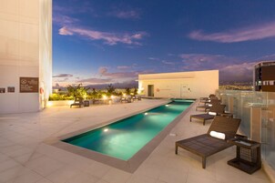 Outdoor pool, open 6 AM to 10 PM, sun loungers