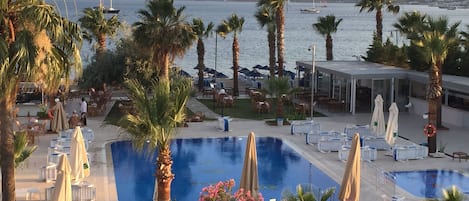 2 outdoor pools, open 9:00 AM to 6:00 PM, pool umbrellas, sun loungers