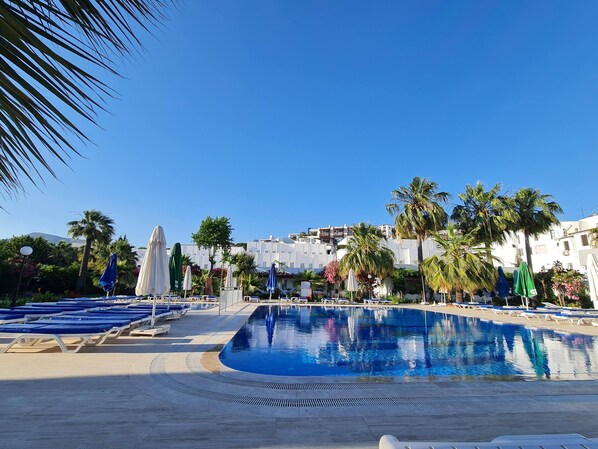 2 outdoor pools, open 9:00 AM to 6:00 PM, pool umbrellas, pool loungers