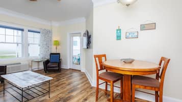 Suite, 1 King Bed, Non Oceanfront View | Living area | 42-inch flat-screen TV with cable channels, TV, DVD player