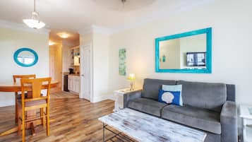Suite, 1 King Bed, Non Oceanfront View | Living area | 42-inch flat-screen TV with cable channels, TV, DVD player