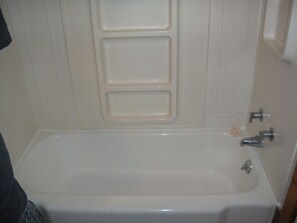 Suite, 1 Bedroom, Kitchenette | Bathroom | Combined shower/tub, hair dryer, towels