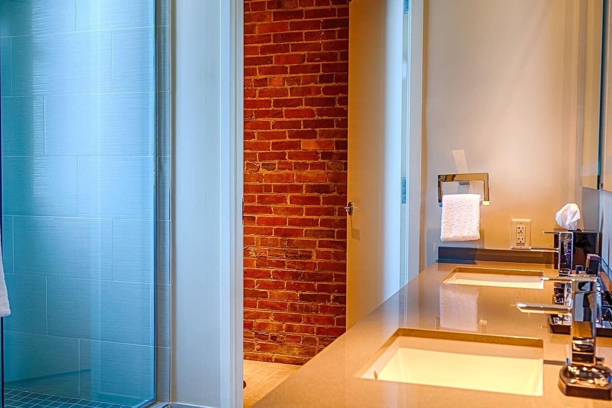 junior suite, 1 king bed | bathroom | shower, hair dryer, bathrobes, towels