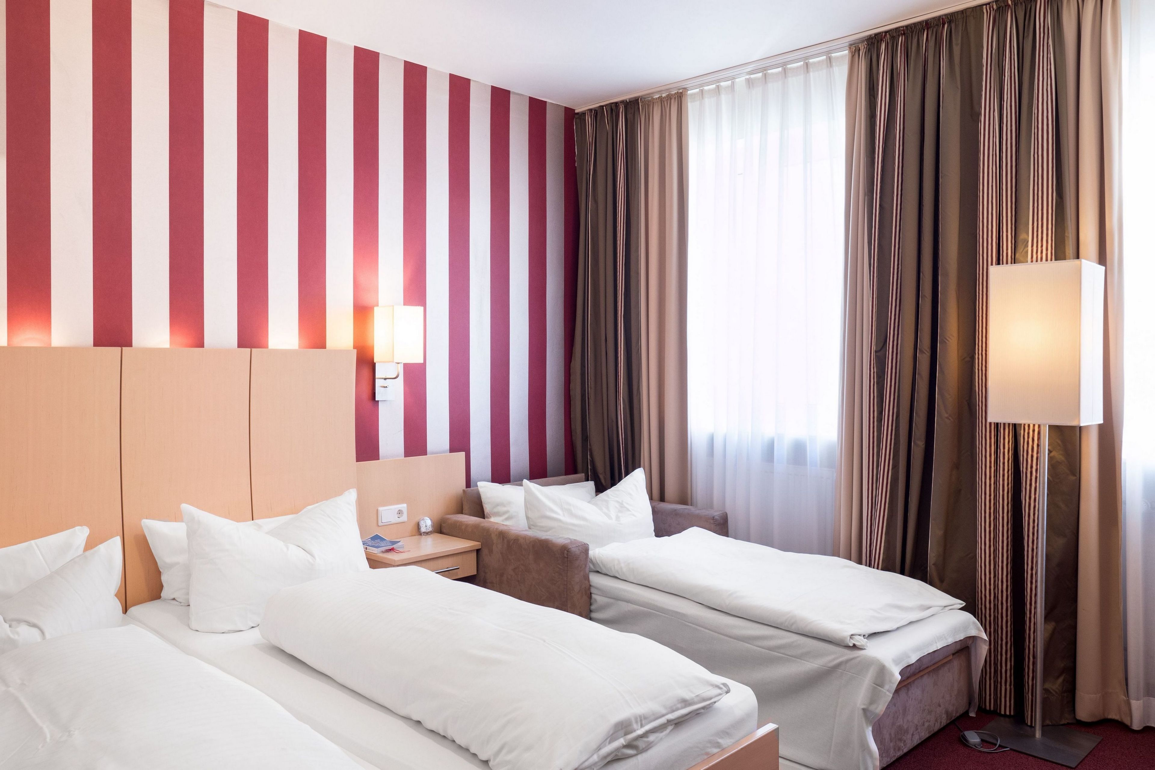 Standard Triple Room | Premium bedding, individually decorated, desk, blackout drapes