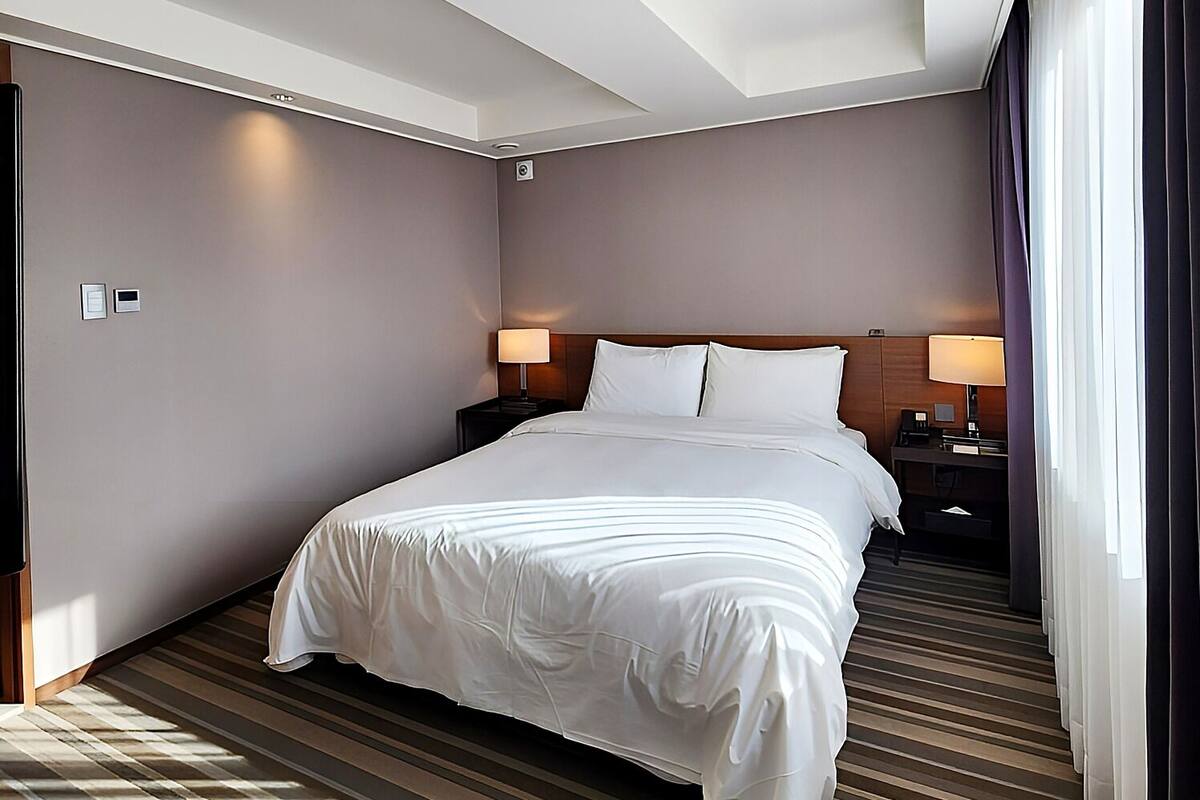 Premium bedding, down duvets, in-room safe, desk