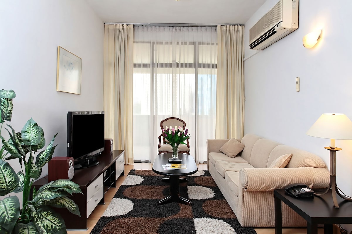 Deluxe Apartment, 2 Bedrooms | Living area | 42-inch LED TV with cable channels, TV, DVD player
