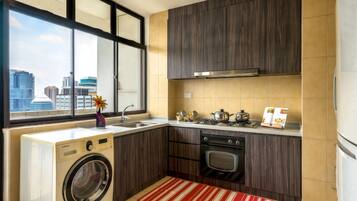 Three-Bedroom Family Room | Private kitchenette | Fridge, microwave, stovetop, highchair