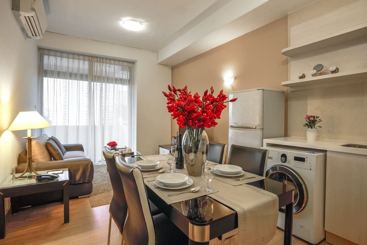 Superior Apartment, 2 Bedrooms | Living area | 42-inch LED TV with cable channels, TV, DVD player