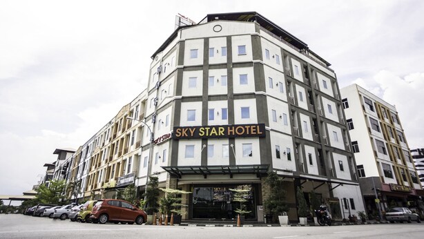 A multi-story hotel with a prominent "SKY STAR HOTEL" sign, featuring a modern architectural design with a mix of balconies and windows. - Sky Star Hotel at KLIA KLIA2 (Sepang)
