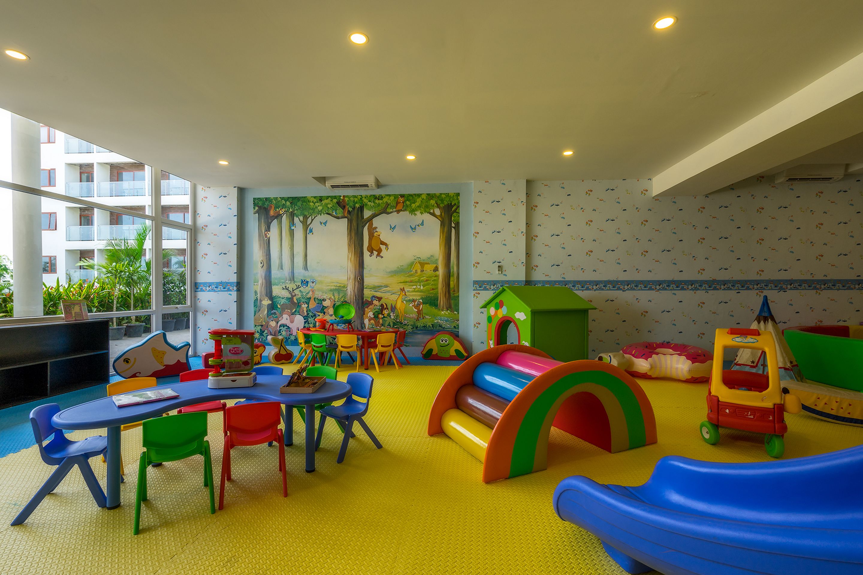 A children's play area with colorful furniture and a slide.